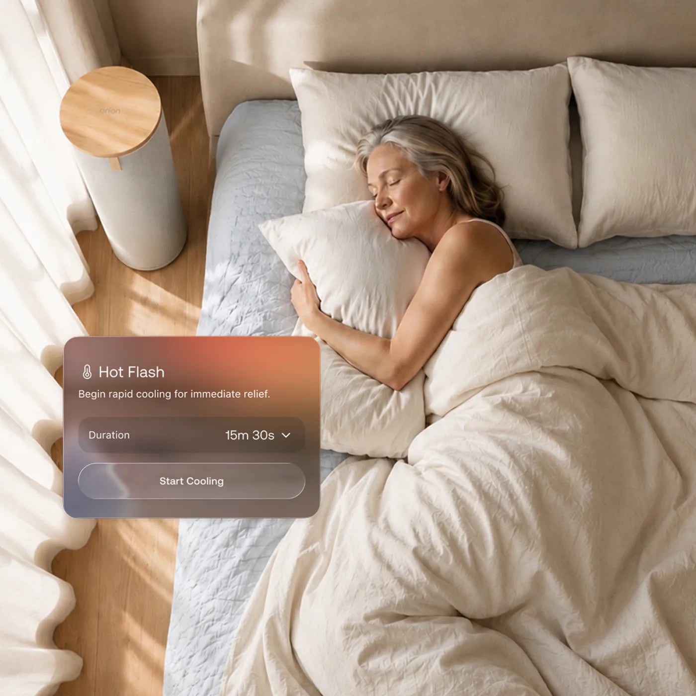 A couple asleep in bed together, each wearing an Orion sleep test patch