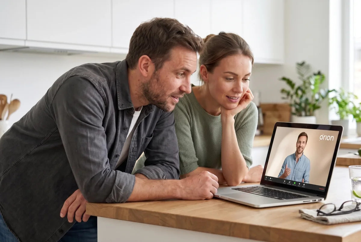 A couple reviewing their sleep results with an Orion advisor over a video call